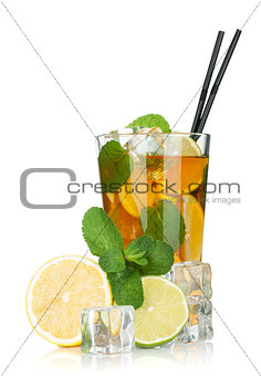 Glass of ice tea with lemon, lime and mint