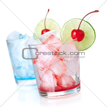 Two cocktails with lime slice and maraschino