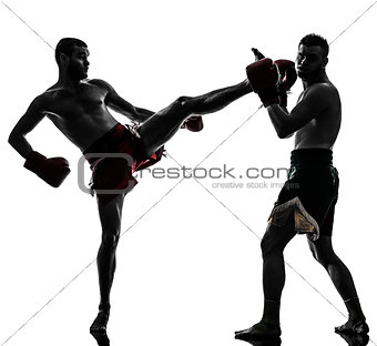two men exercising thai boxing silhouette
