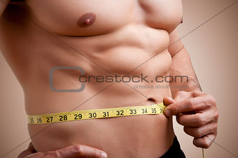 Fit Man Measuring His Waist