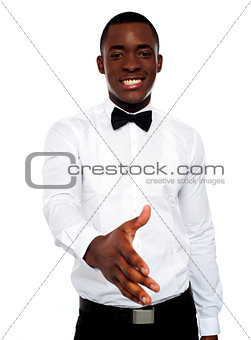 Attractive young man offering handshake