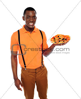 Handsome black man holding pizza
