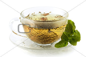 Cup of green tea with lemon and mint