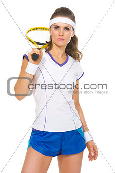 Portrait of serious female tennis player
