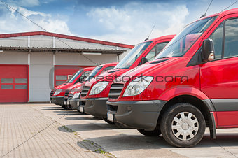 Row of red delivery and service cars