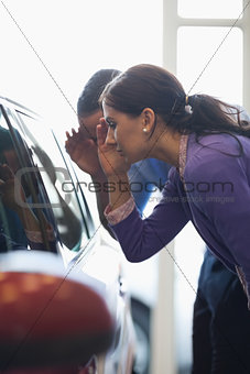 Woman looking in an interior car