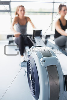 Rowing machine being used in gym