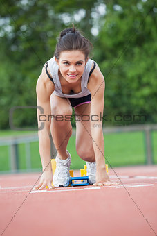 Female athlete at starting blocks