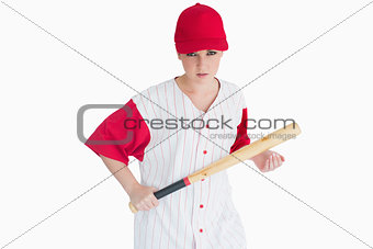 Woman holding a bat seriously