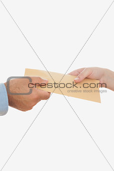Business people holding envelope