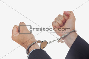 Man in handcuffs clenching fists