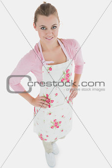 Young maid with hands on waist