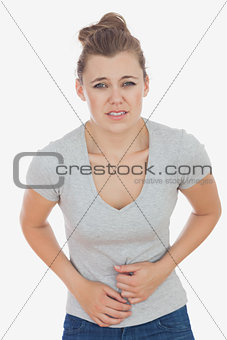 Woman suffering from stomach pain