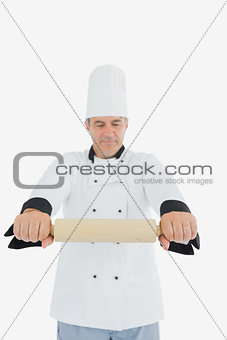Chef holding out rolling pin