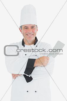 Happy chef holding meat cleaver
