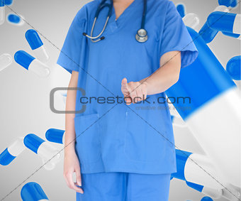 Woman in scrubs working with touch screen