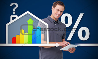 Smiling man working with tablet with energy efficient house graphicg with question and percentage ma