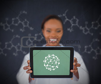 Smiling woman showing us sphere on tablet