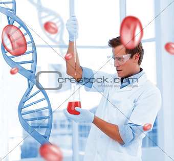 Serious scientist putting chemicals in a testtube