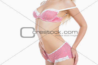 Slim woman in pink lingerie