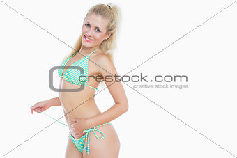 Sexy woman untying bikini bottom