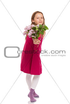 Beautiful young girl with lilac flowers