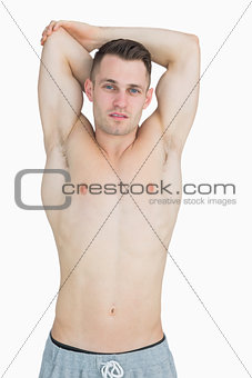 Portrait of bare chested young man posing