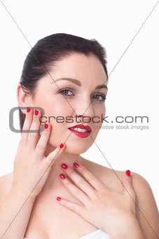 Portrait of woman with red lips and red painted finger nails