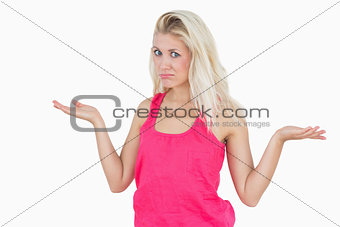 Beautiful young woman gesturing do not know sign