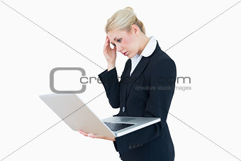 Worried businesswoman on laptop