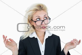 Young business woman gesturing do not know sign