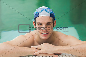 Happy man in the swimming pool