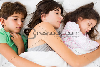 Mother and children asleep