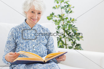 Elderly woman watching pictures