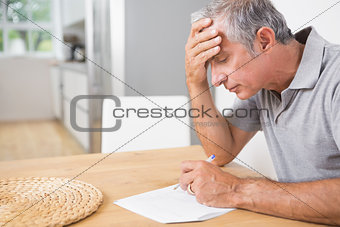 Focused man reading documents