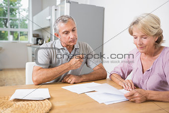 Couple reading documents together