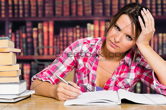 Woman writing on notebook