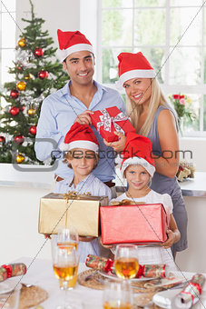 Family holding christmas presents
