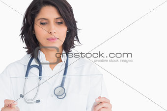 Doctor looking at virtual screen