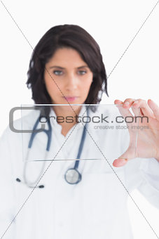 Doctor looking at virtual clear screen