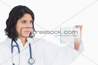 Female doctor looking at virtual screen