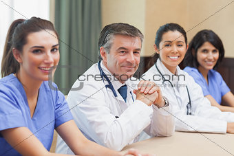 Smiling panel of doctors and nurses