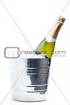 Bottle of champagne chilling in ice bucket