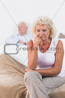 Discouraged old woman sitting