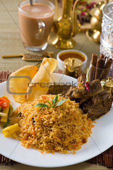 Biryani  rice with traditional items on background