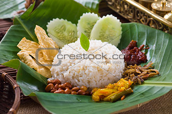 nasi lemak, a traditional malay curry paste rice dish served on 