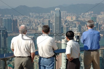 Four gentlemen looking at the commerical city