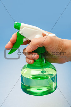 Hand holding water sprayer