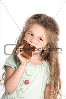 Little girl portrait eating chocolate spread