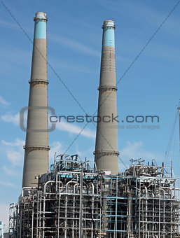 twin smoke stacks at power plant